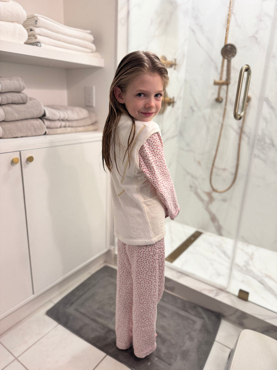 Girl with Pijamas wearing PSV Post shower vest after bath