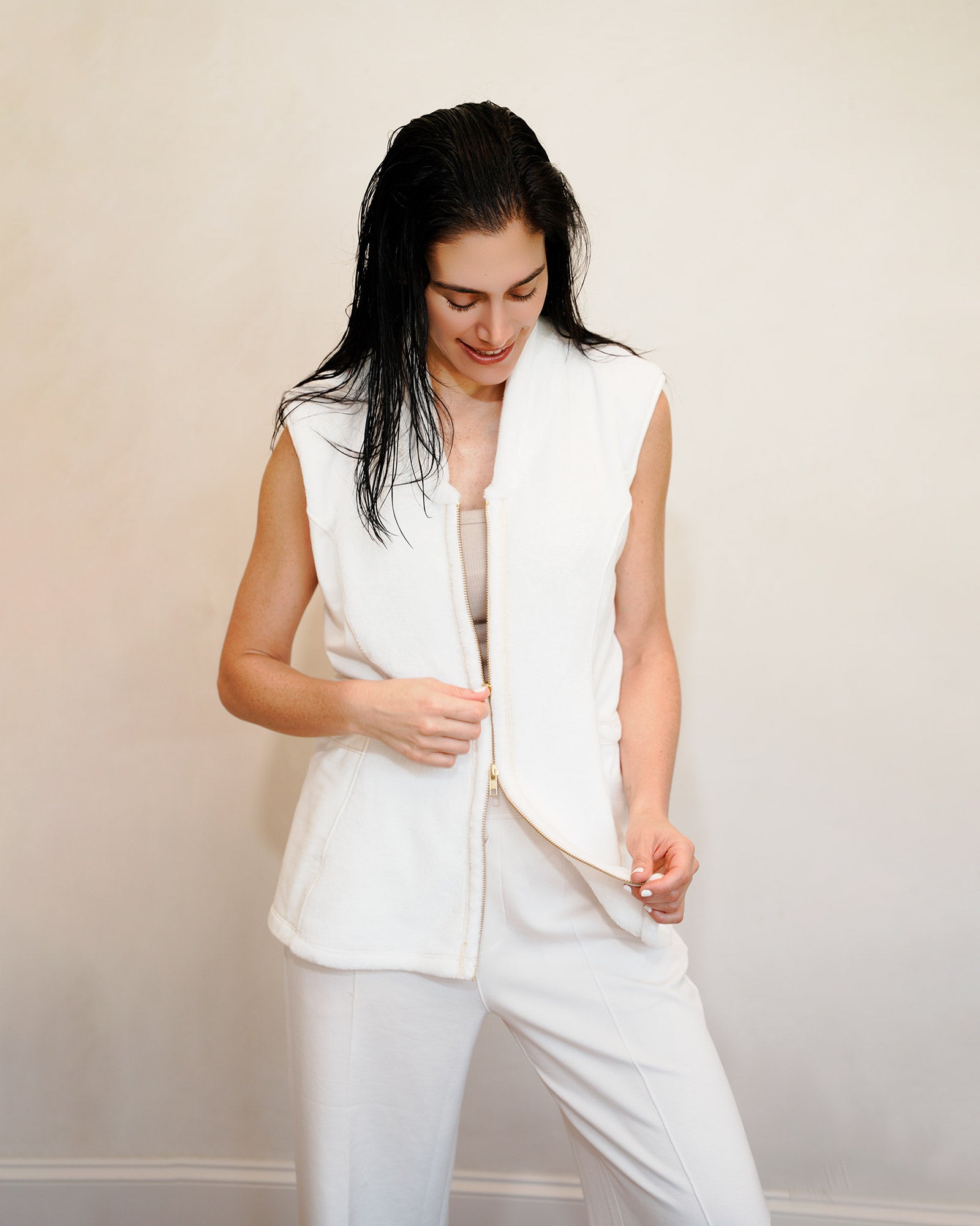 Woman wearing a post shower vest PSV almost open over clothes